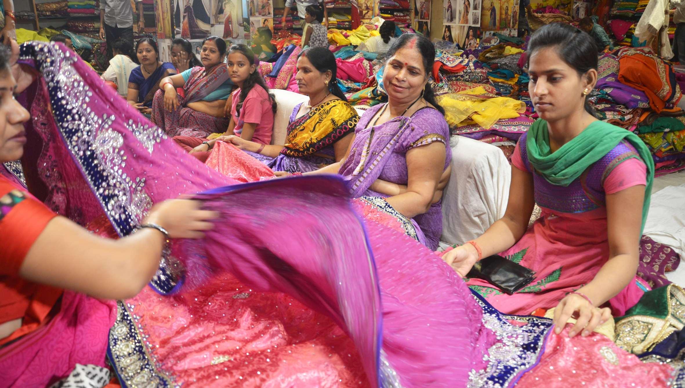 Lucknow: Women busy with Diwali shopping at a shop in Lucknow. (Photo: IANS)