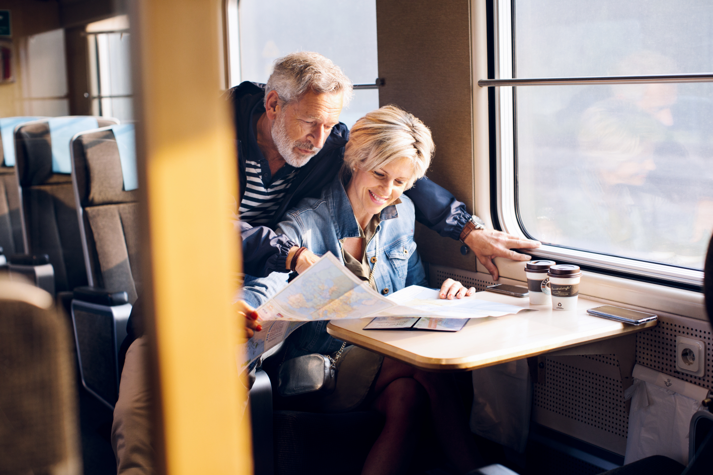 Couple looking at a map in Swedish highspeed train