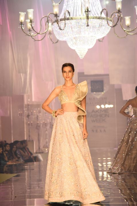 Designer Manish Malhotra's signature cascading winged ruffle blouse at Maahrumysha collection showcase at LFW