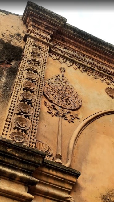 Carving on exterior wall at the entrance 