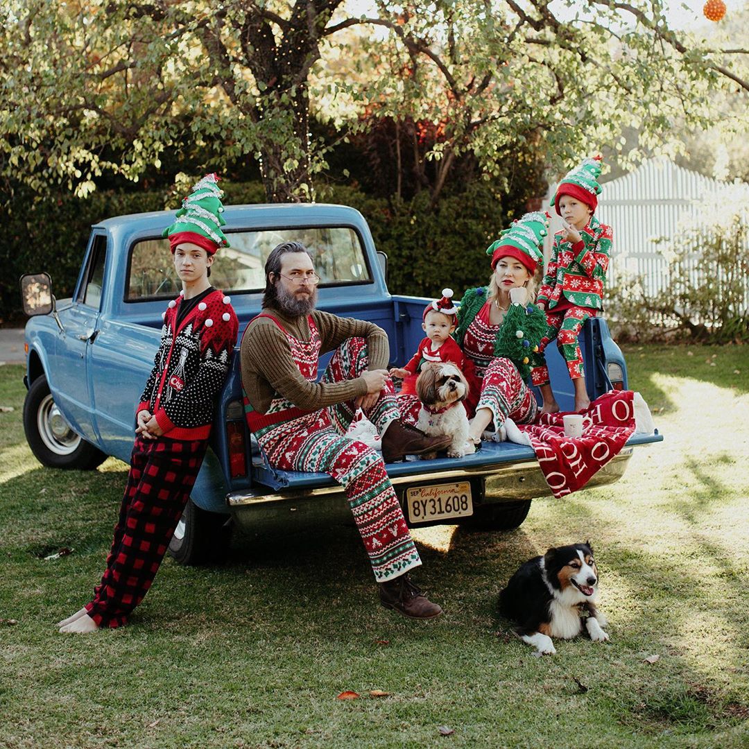 Kate Hudson poses for season's greetings with dogs and kids