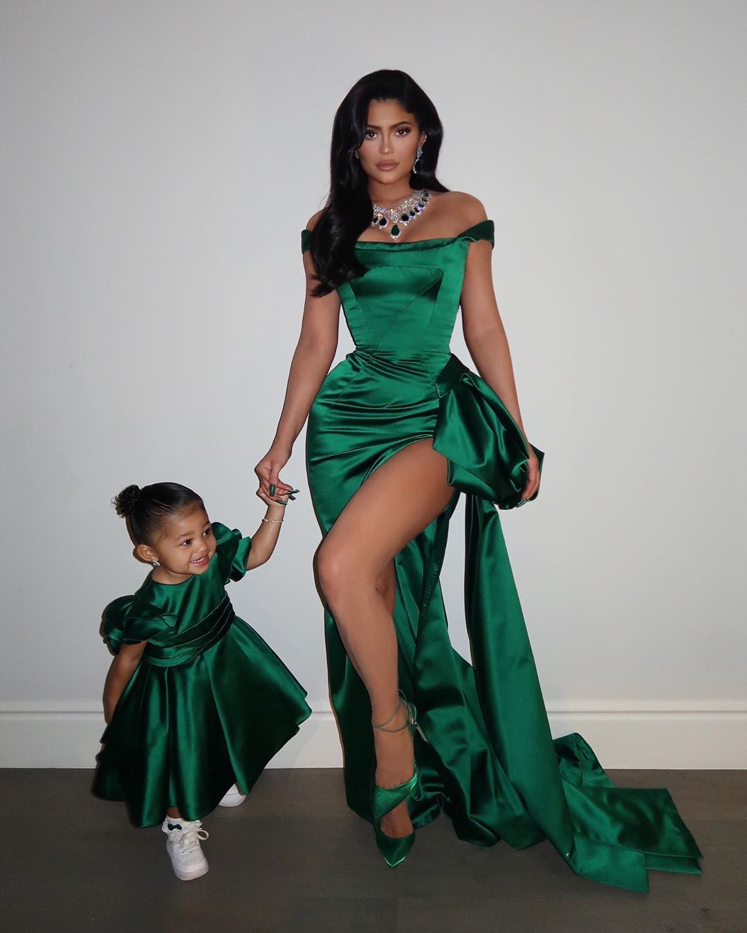 Kylie and Stormi dressed in matching outfits