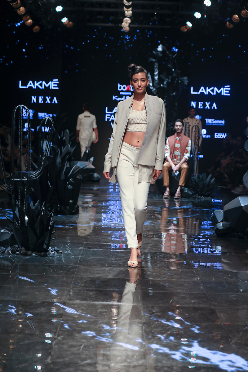 A model walks the ramp wearing fashion designer Kunal Rawal's creation