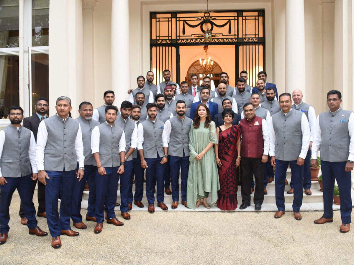Sharma recieved criticism for posing in this photo with the Indian team