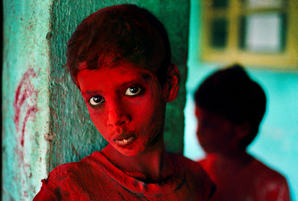 INDIA. Mumbai (Bombay). 1996. Red Boy during Holi festival. © Steve McCurry/Magnum Photos
