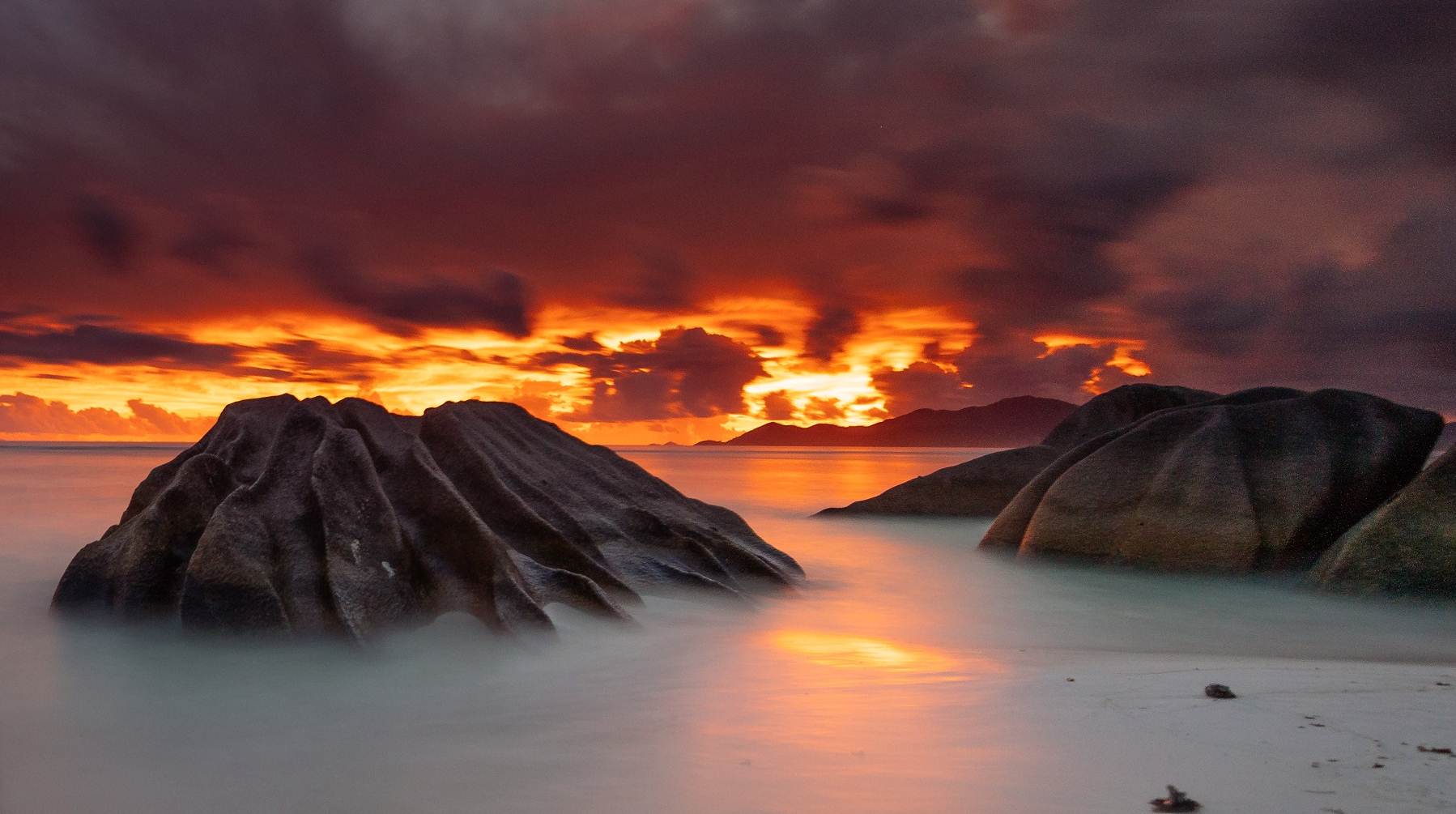 Sunset over granite Anse Source d'Argent, La Digue - image courtesy of Torsten Dickmann