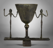 ALBERTO GIACOMETTI (1901-1966) ‘LAMPE COUPE AUX DEUX FIGURES’, CIRCA 1950  patinated bronze 132 x 14⅝ x 7¼ in.  $800,000-1,200,000