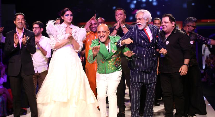 Fashion Design Council of India (FDCI) President Sunil Sethi, fashion designer Manish Arora and actress Huma Qureshi during the 'Rainbow Show' at Grand Finale of Lotus Make-up India Fashion Week, in New Delhi on Oct 13, 2018. (Photo: Amlan Paliwal/IANS)