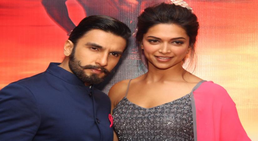 Actors Ranveer Singh and Deepika Padukone during a press conference for the promotion of their upcoming film `Ram-Leela`in New Delhi on Nov.7, 2013. (Photo:Amlan Paliwal/IANS)