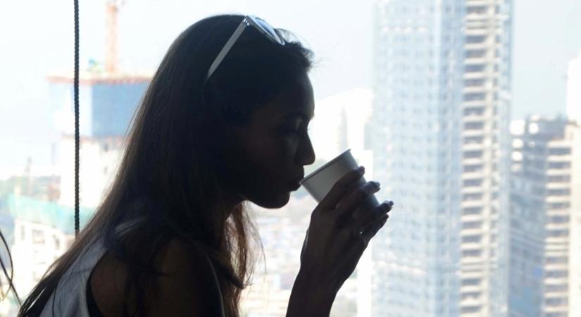 A woman holds a cup. (File Photo: IANS)