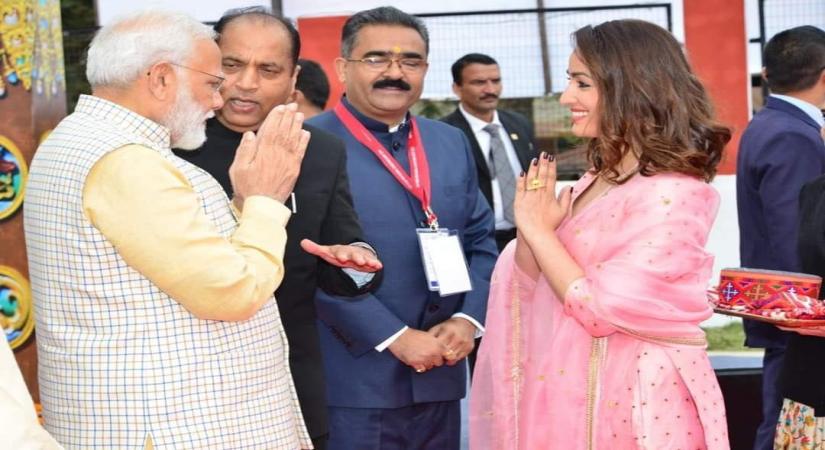 Dharamsala: Prime Minister Narendra Modi being greeted by actress Yami Gautam at the Global Investors' meet at Dharamshala in Himachal Pradesh on Nov 7, 2019. Also seen Himachal Pradesh Chief Minister Jai Ram Thakur. The actress who was in Dharamsala to attend the the two-day event, says she feels honoured to be a part of the event, which was inaugurated by Prime Minister Narendra Modi. (Photo: IANS)
