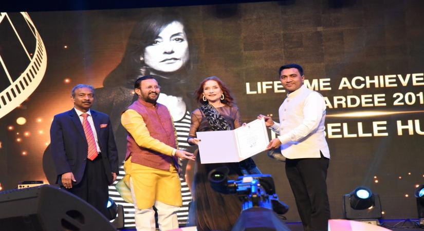 Panaji: Union Environment, Forest and Climate Change and Information and Broadcasting Minister Prakash Javadekar and Goa Chief Minister Pramod Sawant confer the Lifetime Achievement Award on French actor Isabelle Huppert, at the Opening Ceremony of the 50th International Film Festival of India (IFFI-2019) in Panaji, Goa on Nov 20, 2019. Also seen Information and Broadcasting Secretary Amit Khare. (Photo: IANS/PIB)