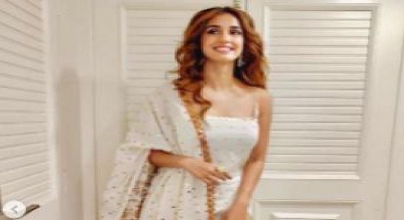 Actress Disha Patani chose a pristine white ensemble for the mahurat puja of her upcoming film "Radhe", starring Salman Khan and directed by Prabhudheva. This is the second time Disha will share screen space with superstar Salman after "Bharat".