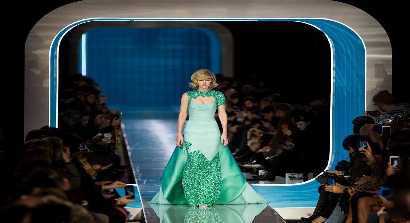 MILAN, Feb. 22, 2018 (Xinhua) -- Model Gigi Hadid presents a creation from the Moschino Autumn/Winter 18/19 women collection during Milan Fashion Week in Milan, Italy, Feb. 21, 2018. Milan fashion week kicked off Tuesday, and will last until Feb. 26. (Xinhua/Jin Yu/IANS)