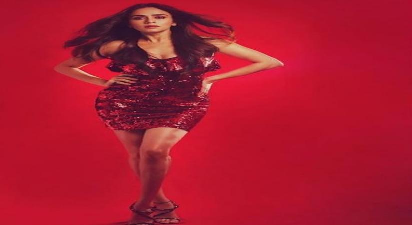 Actress Amruta Khanvilkar recently took to Instagram and shared a perfect sparkly look. Wearing a red sequin dress and blending her look with light make-up, Amruta left her fans in awe of her style quotient.