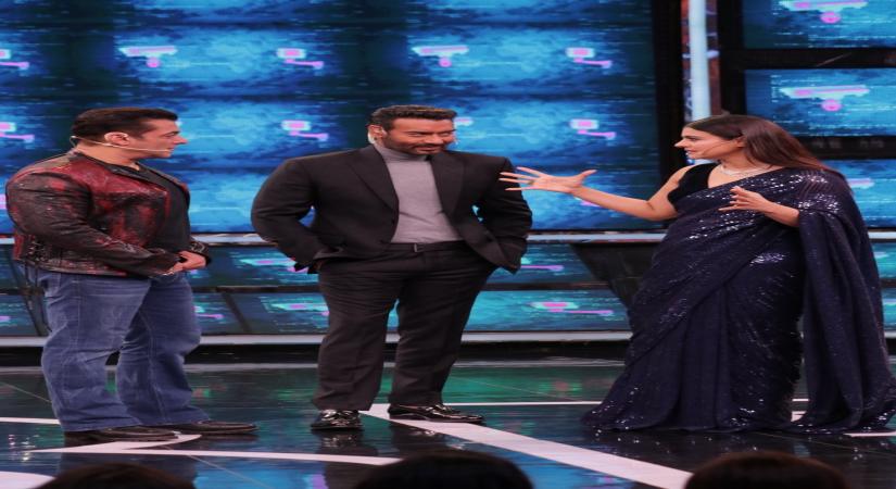 Actor and reality television show Bigg Boss host Salman Khan with actors Kajol and Ajay Devgn on the sets of the show.