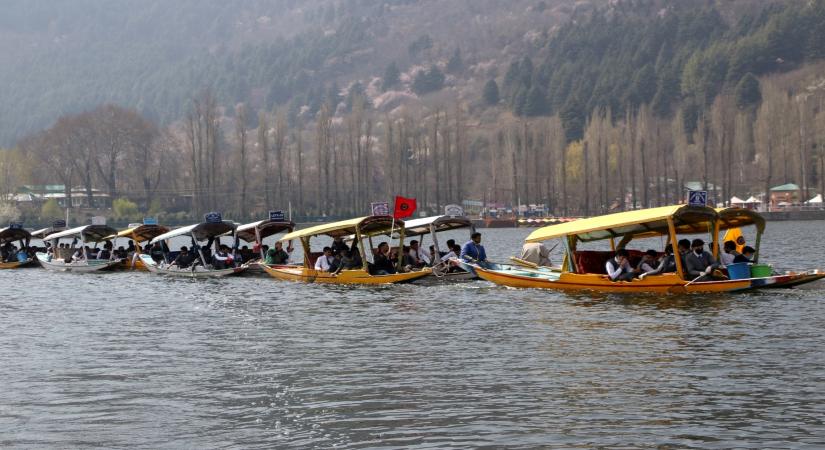 Srinagar: People participate in a shikara rally at Dal lake in Srinagar on March 22, 2018. (Photo: IANS)
