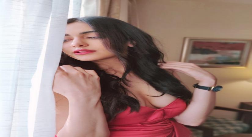 Bollywood actress Adah Sharma looked hot in a stunning red off shoulder gown. Adah looked stunning in a bright red off shoulder gown with a thigh high slit.