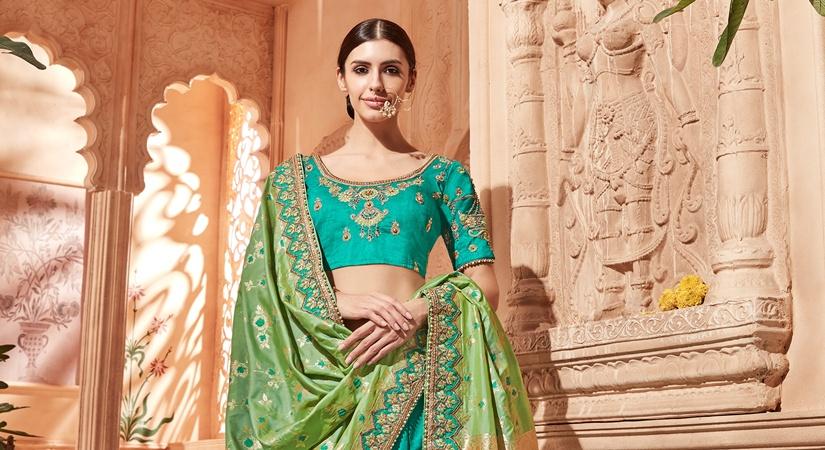 ODHNI's woven art silk lehanga in Teal Green colour