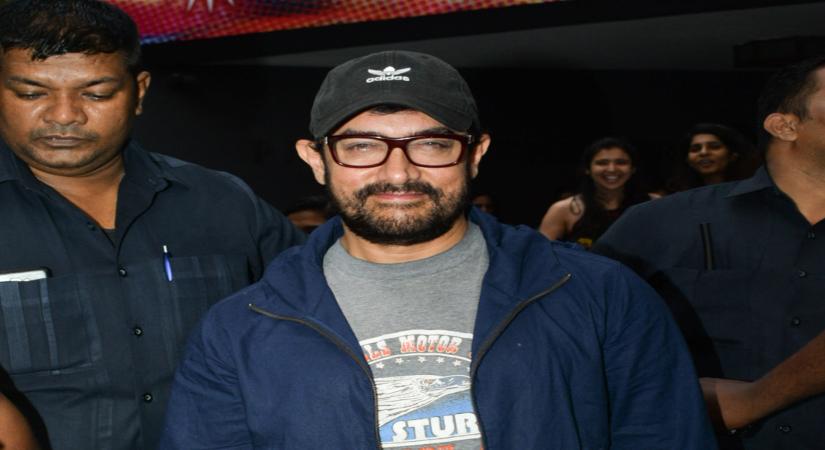 Mumbai: Actor Aamir Khan seen outside a theatre, in Mumbai's Juhu, on May 23, 2019. (Photo: IANS)