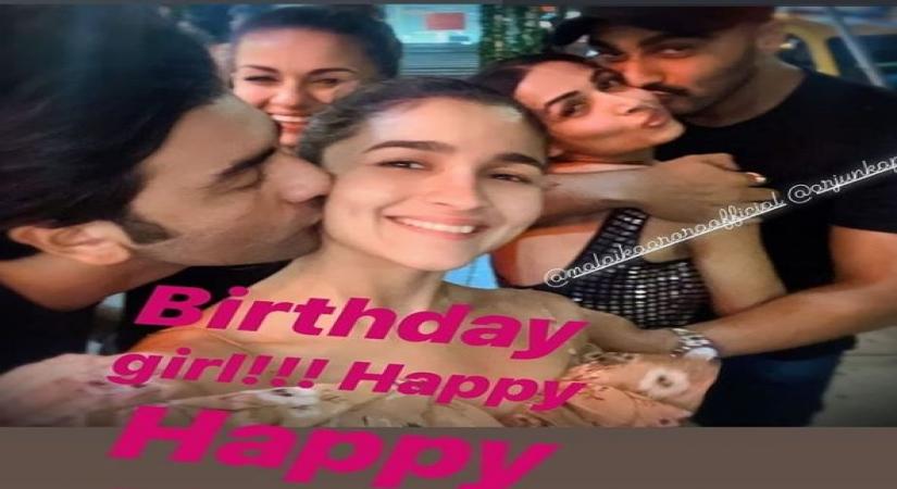 A picture of actor Ranbir Kapoor giving a sweet kiss to actress Alia Bhatt, who just turned 27, has gone viral on social media. In the photo, Ranbir can be seen giving a peck on Alia's cheek. In the background, Arjun Kapoor can be seen holding Malaika close. According to celebrity photographer Viral Bhayani the picture was shared by philanthropist Natasha Poonawalla.