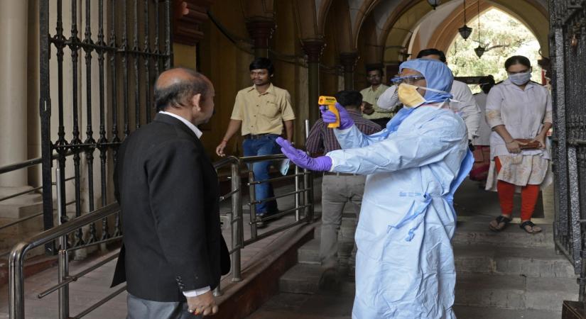 Kolkata: A lawyer being screened for COVID-19 amid coronavirus pandemic at Calcutta High Court, on March 17, 2020. (Photo: Kuntal Chakrabarty/IANS)