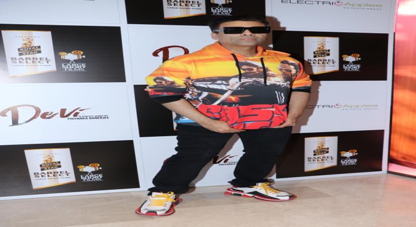 Mumbai, April 1 (IANS) Filmmaker Karan Johar's children Yash and Roohi don't like their 'dadda's' style and want him to dress in "simple clothes".	 (File Photo: IANS)