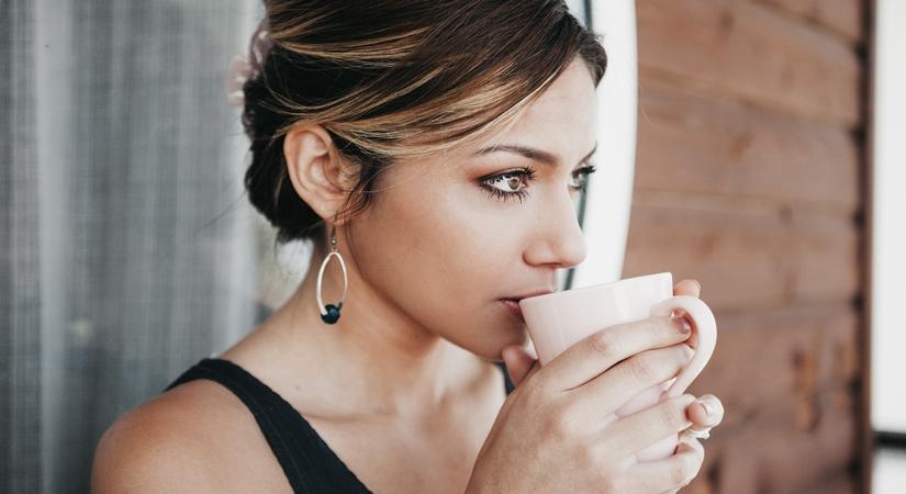 A woman drinking coffee