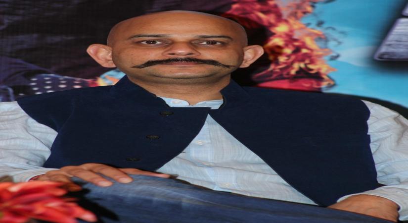 Filmmaker Vijay Krishna Acharya addresses during a promotional event of his upcoming film `Dhoom 3` in Chennai on Dec.17, 2013. (Photo: IANS)