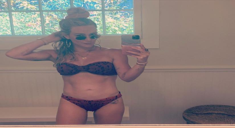 Hilary Duff flaunts toned abs.