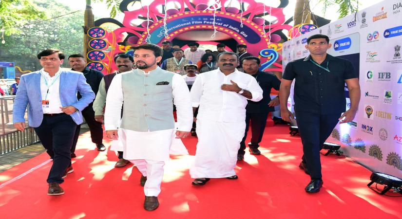 Goa: Union Minister for Information & Broadcasting, Youth Affairs & Sports, Anurag Singh Thakur and Union Minister of State for Fisheries, Animal Husbandry & Dairying, Information and Broadcasting, Dr. L. Murugan at the red carpet with the crew of Alma and Oskar at the 53rd International Film Festival of India (IFFI), in Goa on November 20, 2022. (Photo: PIB/IANS)
