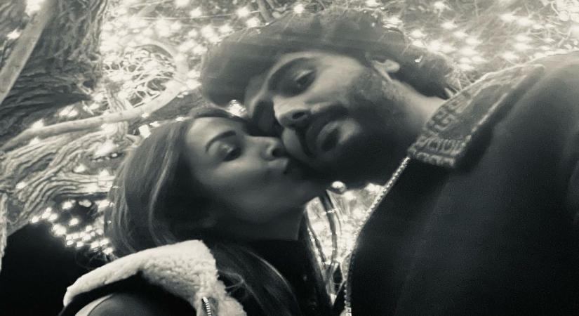 Malaika kisses Arjun in New Year picture