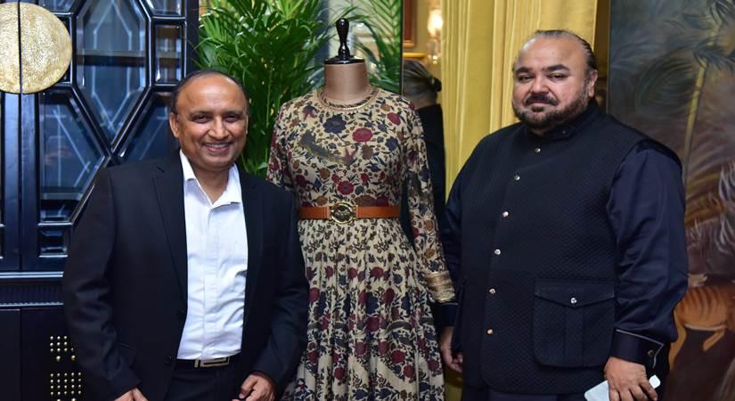 Shashank Srivastava and JJ Valaya pose with the outfit from the collection