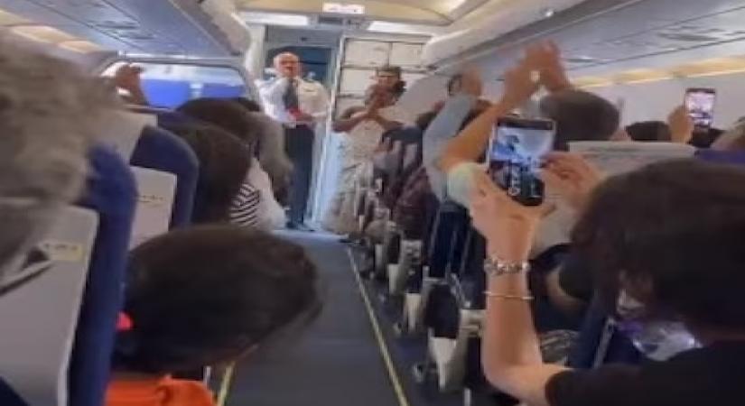 Bomman, Bellie of 'The Elephant Whisperers' cheered as they board flight (grab)