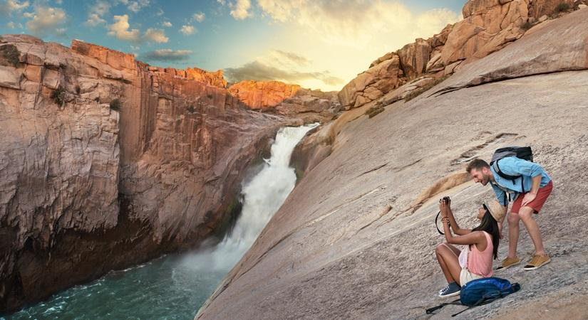 Couple photographing Augrabies falls.