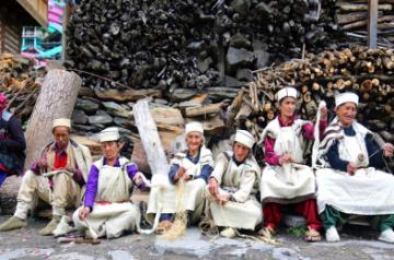 Locals of Manala village in Himachal Pradesh spinning yarn