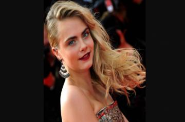 CANNES, May 21, 2014 (Xinhua) -- Cara Delevingne arrives at the red carpet for the screening of the film "The Search" at the 67th Cannes Film Festival in Cannes, southern France, on May 21, 2014. (Photo: Xinhua/Chen Xiaowei/IANS)