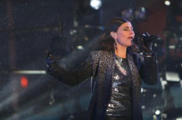 NEW YORK, Jan. 1, 2015 (Xinhua) -- American singer Idina Menzel performs during the New Year's Eve celebration at Times Square in New York, the United States on Dec. 31, 2014.  Times Square has been the center of worldwide attention on New Year's Eve for more than 100 years. The first Ball Lowering celebration occurred in 1907, and this tradition is now a universal symbol of welcoming the New Year. (Xinhua/Qin Lang/IANS) (lyi)