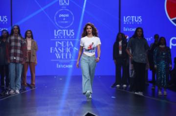 New Delhi: Actress Disha Patani walks the ramp showcasing collection from Pepsi's ready-to-wear label HUEMN on the first day of Lotus Make-up India Fashion Week, in New Delhi on Oct 9, 2019. Pepsi marked its foray into the fashion industry through a collaboration with label HUEMN, that was launched at FDCI's Lotus India Fashion Week SS20. The collection, created by designer duo Pranav Misra and Shyma Shetty, comprises statement athleisure. All denim fabric used in the collection is made using re