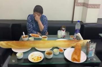 Ditching the diet, actress Sara Ali Khan and her actress mother Amrita Singh gorged on a giant dosa. Taking to Instagram, Sara recorded a video, where Amrita is seen sitting with scrumptious delicacies laid on the table.
