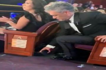 Video of Taika Waititi hiding his Oscar trophy under a seat goes viral.