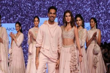  Actress and showstopper Tara Sutaria with fashion designer Punit Balana on Day 5 of the Lakme Fashion Week Summer/Resort 2020, in Mumbai on Feb 15, 2020. (Photo: IANS)