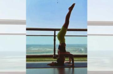 Alaya F pulls off a complicated inversion yoga pose.
