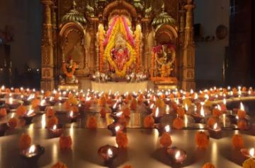 Mumbai: Siddhivinayak Temple light up with 'diyas' after Prime Minister Narendra Modi urged people in a video message to the nation to turn off their lights for nine minutes at 09:00 pm on April 5 and light a candle or a 'diya' or even use the flashlight to mark the country' fight against COVID-19 pandemic in Mumbai on April 5, 2020. (Photo: IANS)