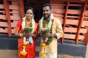 Manikandan Achari with his wife Anjali.