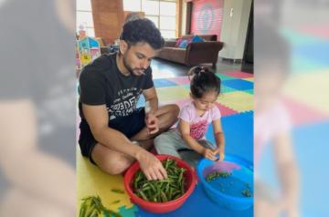 Lockdown diaries: Kunal Kemmu peels 'matar' with daughter Inaya.