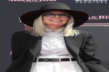 Firuzkuh: Los Angeles: American actress Diane Keaton stands in wet cement barefoot during a ceremony honouring the actress by leaving her handprints and footprints at the TCL Chinese Theater IMAX on 11 August 2022. (Photo: INina Prommer/ZUMA Press Wire/dpa/IANS)