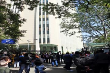 New Delhi: Media persons stand outside the office of BBC during a raid by the Income Tax authorities in New Delhi on Tuesday, Feb. 14, 2023. (Photo: Anupam Gautam/IANS)