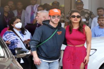 Mumbai : Actress Priyanka Chopra with husband Nick Jonas and daughter Malti Marie Chopra Jonas at Mumbai airport on Friday, March 31, 2023. (Photo:Sanjay Tiwari/IANS)