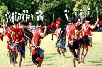 Naga artists perform traditional war dance during the Garo tribe's famous 100 Drums Wangala Festival in the outskirts of Tura in Meghalaya on Nov 6, 2014. (Photo Courtesy: IANS)